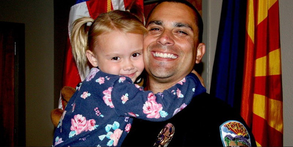 A police officer responds to a report of child abuse at a residence, forcefully enters by kicking the door, and discovers his own daughter inside.