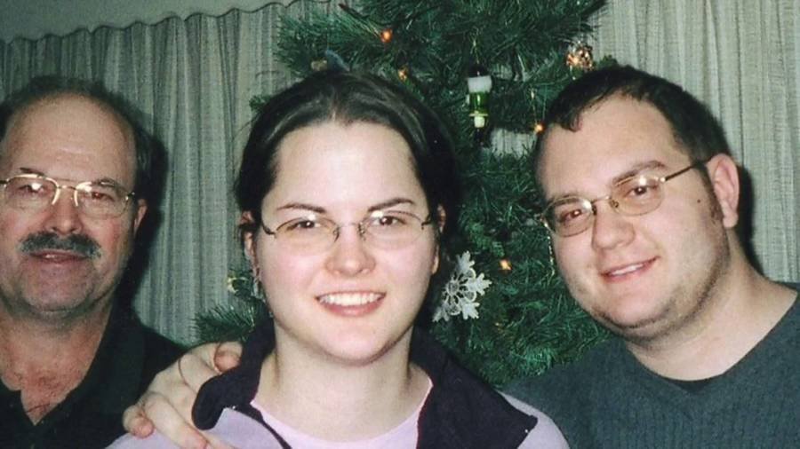 Dennis Rader, the BTK Killer, with his children at Christmas.
